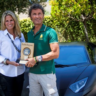 President and CEO of Automobili Lamborghini receiving "Best of the Best Sports Car" Award from Cristina Cheever in Monte