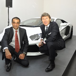 Mohan Mariwala and Stephan Winkelmann posing next to Aventador LP 700-4 at the opening of new dealer in Mumbai, IN.
